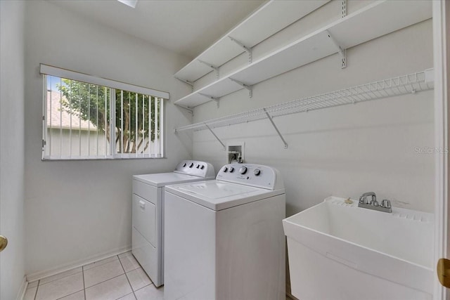 1216 Fox Chapel Dr, Lutz, FL 33549 - laundry area featuring washing machine and clothes dryer and light tile patterned flooring