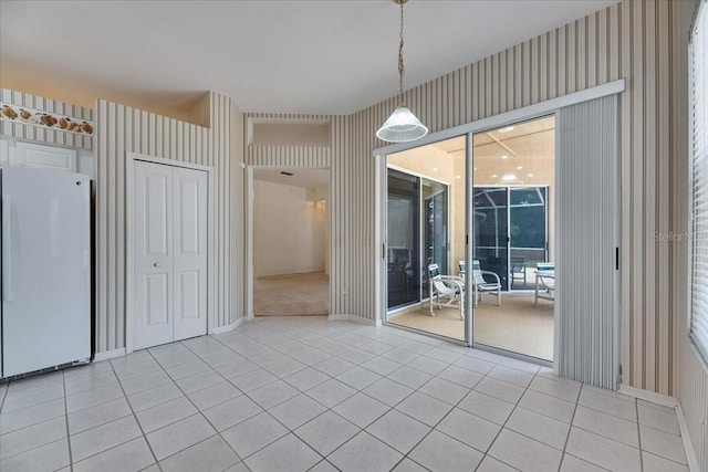 1216 Fox Chapel Dr, Lutz, FL 33549 - unfurnished dining area with wallpapered walls and light tile patterned floors