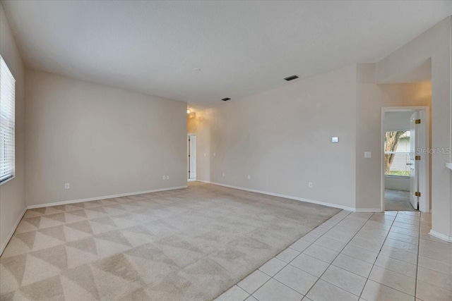 1216 Fox Chapel Dr, Lutz, FL 33549 - unfurnished room with light colored carpet and light tile patterned flooring