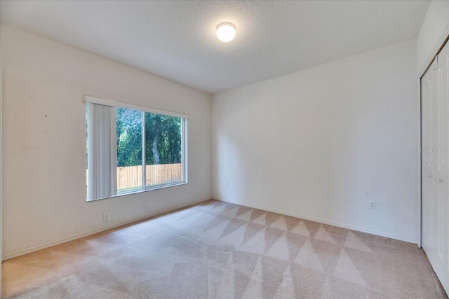 1216 Fox Chapel Dr, Lutz, FL 33549 - unfurnished room featuring light carpet and a textured ceiling