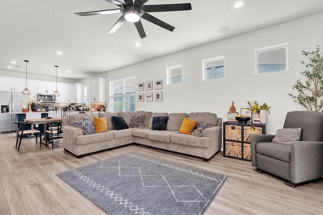 6352 Mooring Line Cir, Apollo Beach, FL 33572 - living room featuring a ceiling fan, recessed lighting, and light wood-type flooring