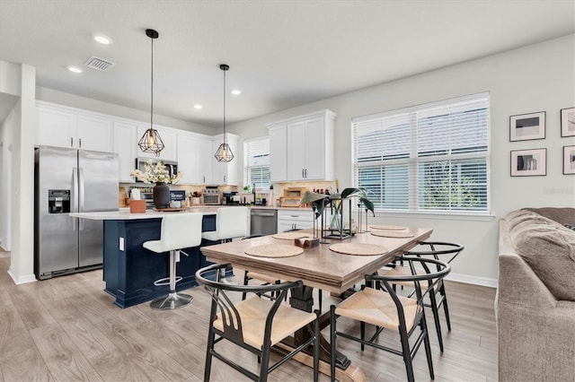 6352 Mooring Line Cir, Apollo Beach, FL 33572 - dining space featuring light wood-style floors and recessed lighting