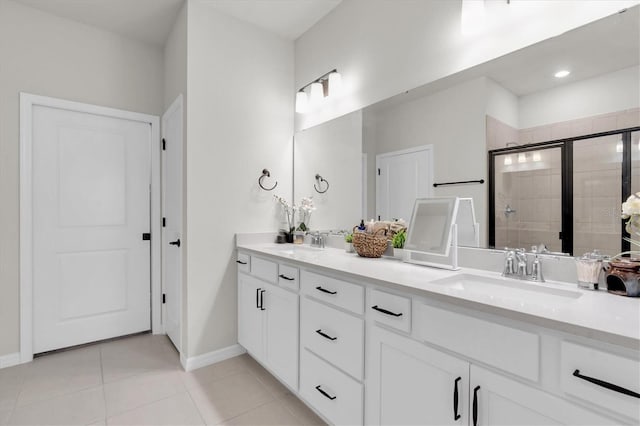 6352 Mooring Line Cir, Apollo Beach, FL 33572 - bathroom featuring double vanity, a stall shower, and tile patterned floors