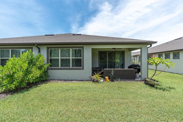 6352 Mooring Line Cir, Apollo Beach, FL 33572 - back of house with stucco siding, an outdoor hangout area, ceiling fan, and a lawn