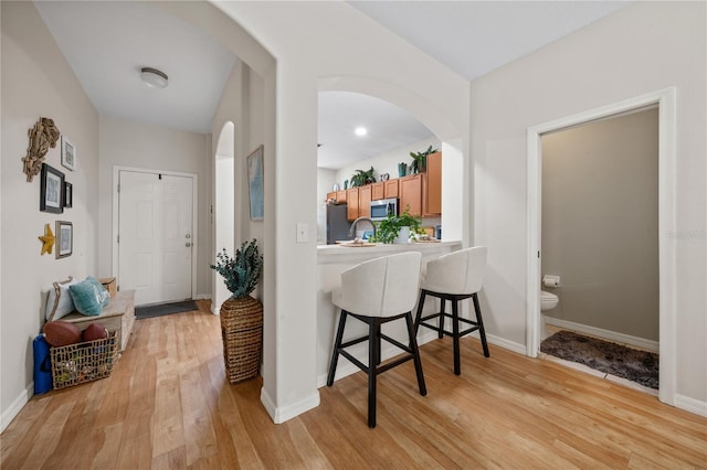2349 Willimette Dr, Wesley Chapel, FL 33543 - entryway featuring arched walkways and light wood-type flooring