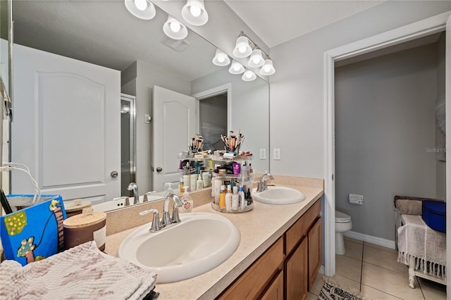 2349 Willimette Dr, Wesley Chapel, FL 33543 - full bath featuring tile patterned flooring, double vanity, and a shower with door