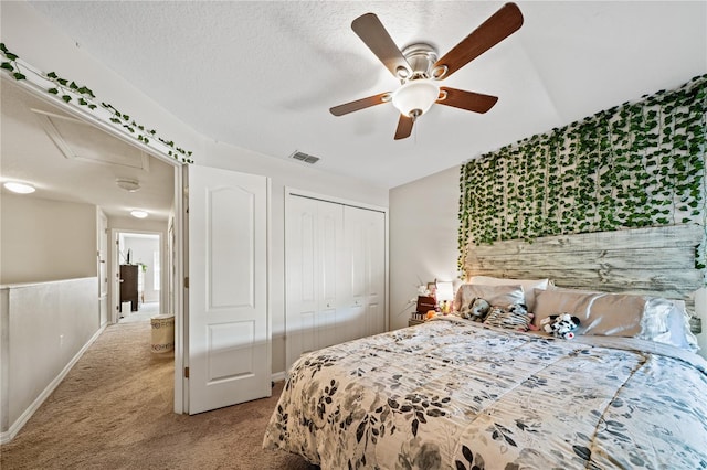 2349 Willimette Dr, Wesley Chapel, FL 33543 - bedroom with light colored carpet, a closet, a ceiling fan, and a textured ceiling