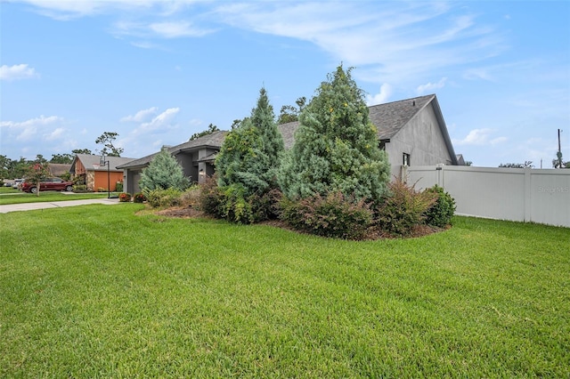 2701 Herndon St, Valrico, FL 33596 - view of home's exterior featuring concrete driveway, roof with shingles, and an attached garage