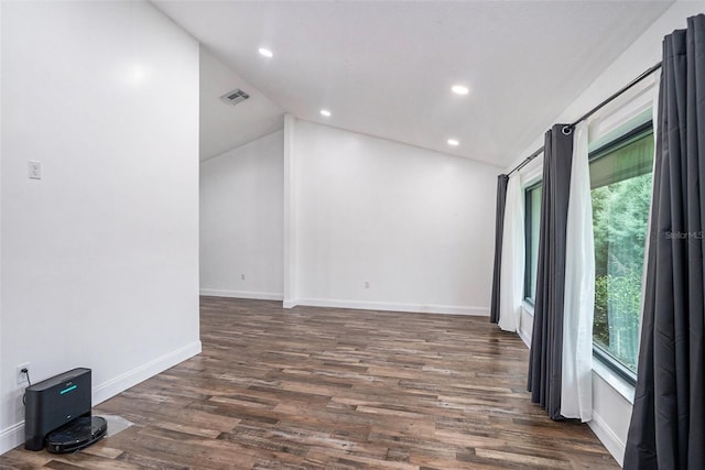 2701 Herndon St, Valrico, FL 33596 - spare room with lofted ceiling, dark wood finished floors, and recessed lighting