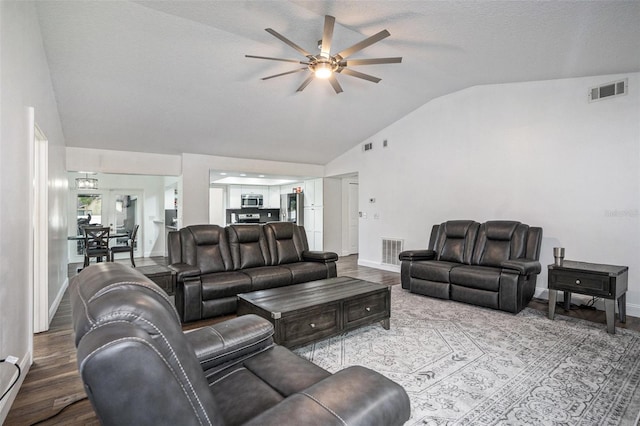 2701 Herndon St, Valrico, FL 33596 - living room featuring vaulted ceiling, ceiling fan, and wood finished floors