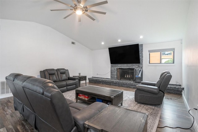 2701 Herndon St, Valrico, FL 33596 - living room featuring dark wood-type flooring, a ceiling fan, vaulted ceiling, a fireplace, and recessed lighting