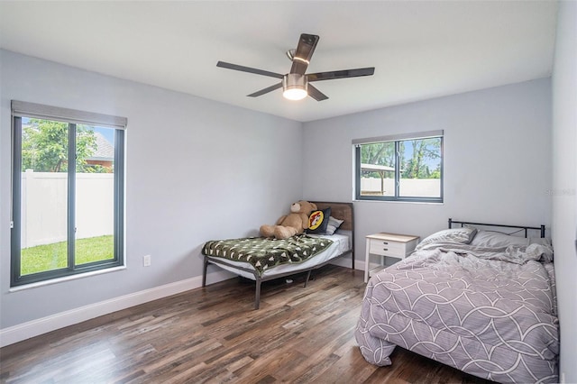 2701 Herndon St, Valrico, FL 33596 - bedroom featuring multiple windows, wood finished floors, and a ceiling fan