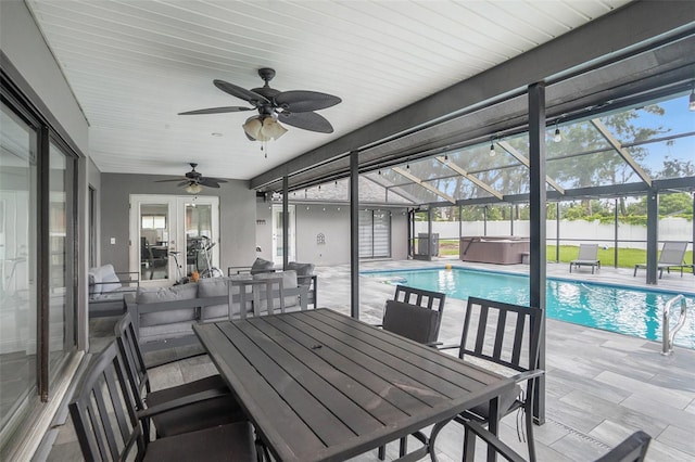 2701 Herndon St, Valrico, FL 33596 - view of pool featuring a hot tub, a patio, french doors, a ceiling fan, and outdoor dining space
