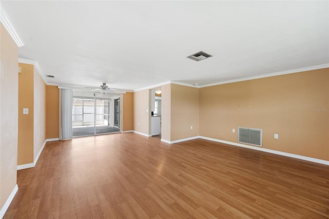 5720 Mockingbird Dr, New Port Richey, FL 34652 - unfurnished living room with crown molding, a ceiling fan, and light wood-style floors