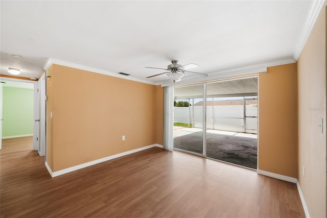 5720 Mockingbird Dr, New Port Richey, FL 34652 - spare room featuring crown molding, a ceiling fan, and wood finished floors