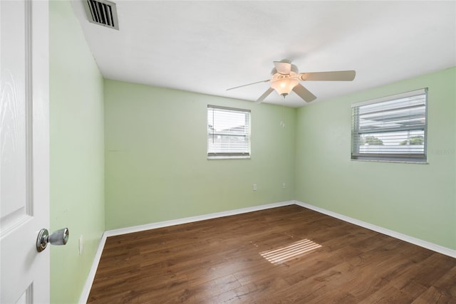 5720 Mockingbird Dr, New Port Richey, FL 34652 - unfurnished room featuring wood finished floors and ceiling fan
