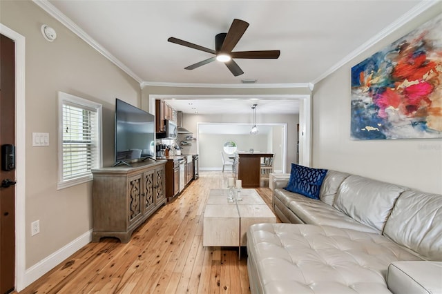 1722 Albemarle Rd, Clearwater, FL 33764 - living room with a ceiling fan, light wood-style flooring, and crown molding