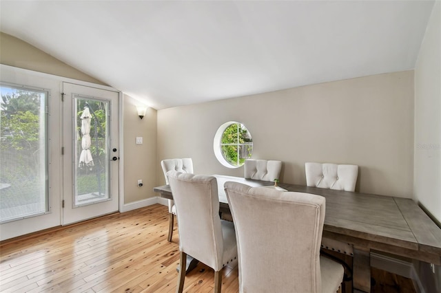 1722 Albemarle Rd, Clearwater, FL 33764 - dining space featuring lofted ceiling, plenty of natural light, and light wood finished floors
