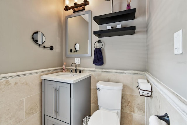 1722 Albemarle Rd, Clearwater, FL 33764 - half bathroom featuring tile walls, wainscoting, and vanity