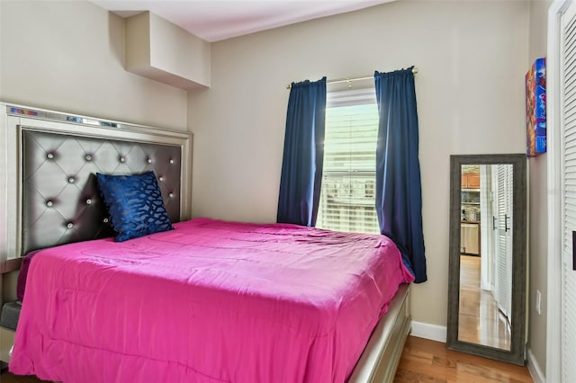 1722 Albemarle Rd, Clearwater, FL 33764 - bedroom with wood finished floors and baseboards
