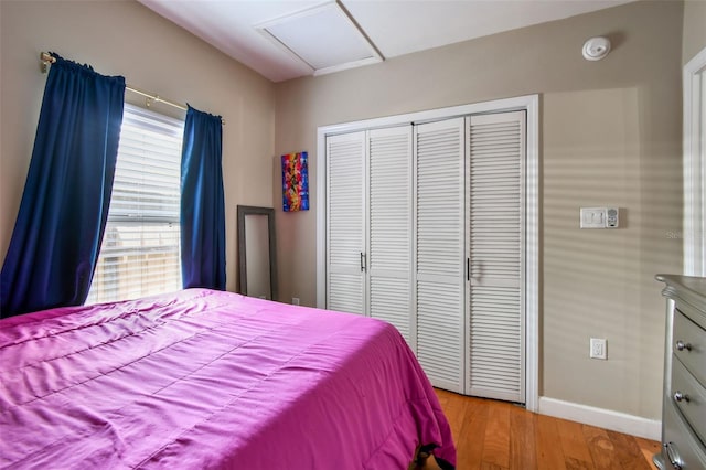 1722 Albemarle Rd, Clearwater, FL 33764 - bedroom featuring a closet, wood finished floors, and attic access