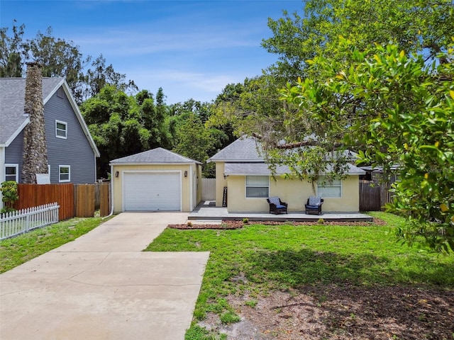 1722 Albemarle Rd, Clearwater, FL 33764 - view of front of property with driveway, stucco siding, a garage, and an outdoor structure