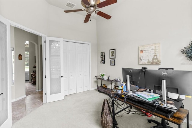 2900 W Lantana Dr, Beverly Hills, FL 34465 - office with a high ceiling, arched walkways, a ceiling fan, and carpet