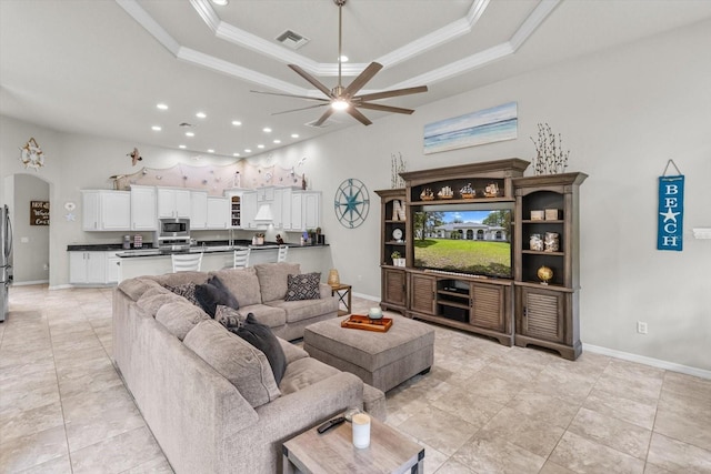 2900 W Lantana Dr, Beverly Hills, FL 34465 - living area with recessed lighting, ornamental molding, a ceiling fan, a raised ceiling, and arched walkways