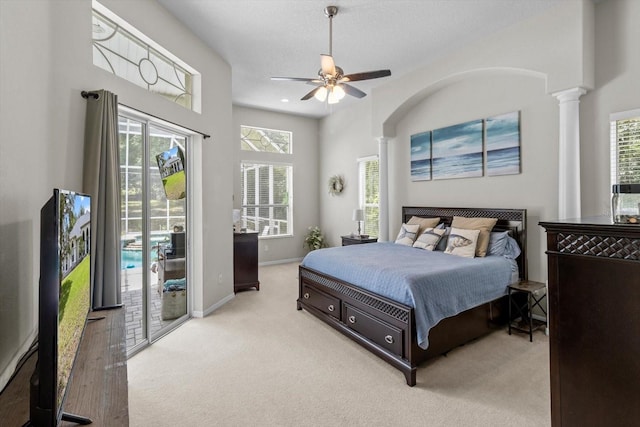 2900 W Lantana Dr, Beverly Hills, FL 34465 - carpeted bedroom with access to outside, ornate columns, multiple windows, and a ceiling fan