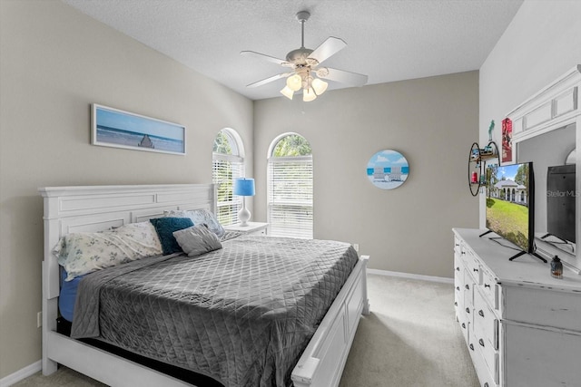 2900 W Lantana Dr, Beverly Hills, FL 34465 - bedroom featuring light colored carpet, a textured ceiling, and a ceiling fan