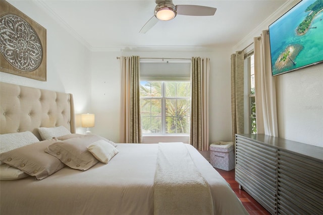 4221 W Spruce St Unit 2328, Tampa, FL 33607 - bedroom with crown molding, dark wood-style floors, and ceiling fan