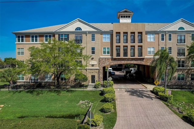 4221 W Spruce St Unit 2328, Tampa, FL 33607 - view of property featuring decorative driveway