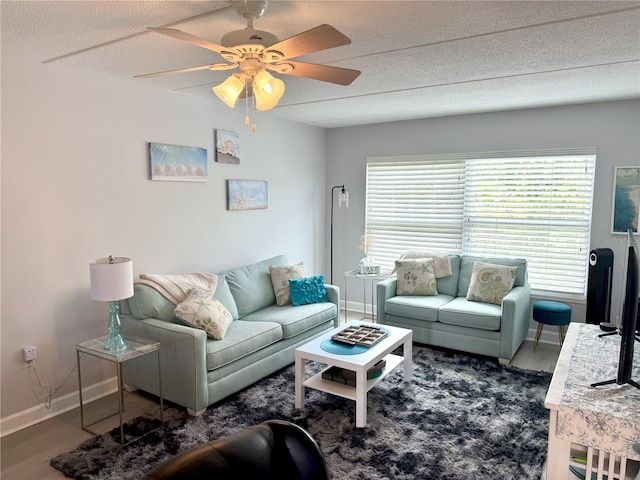 12760 Indian Rocks Rd Unit 909, Largo, FL 33774 - living room featuring a ceiling fan, wood finished floors, and a textured ceiling