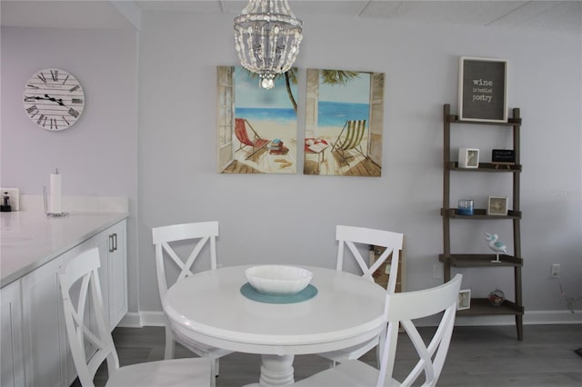 12760 Indian Rocks Rd Unit 909, Largo, FL 33774 - dining area featuring a chandelier and wood finished floors