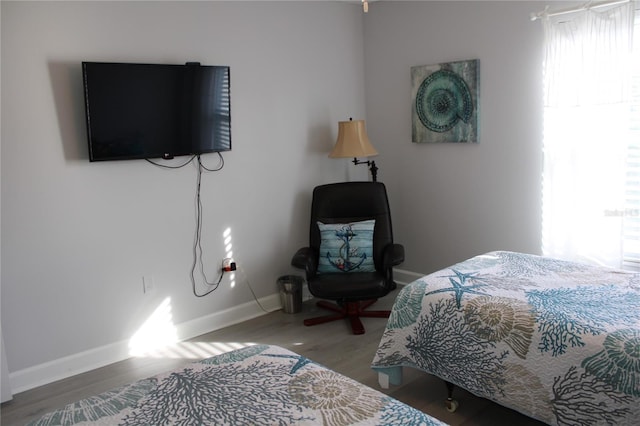 12760 Indian Rocks Rd Unit 909, Largo, FL 33774 - bedroom featuring multiple windows and wood finished floors