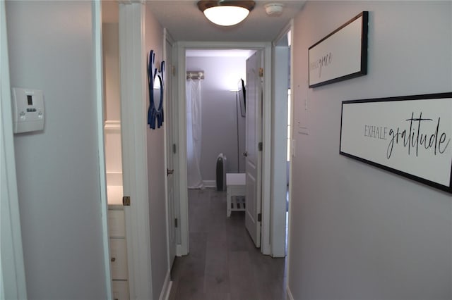 12760 Indian Rocks Rd Unit 909, Largo, FL 33774 - corridor featuring baseboards and wood finished floors