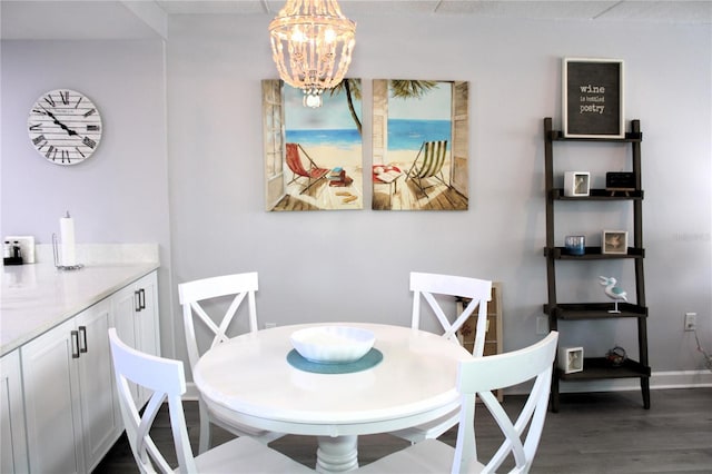 12760 Indian Rocks Rd Unit 909, Largo, FL 33774 - dining area featuring a chandelier and dark wood-style floors