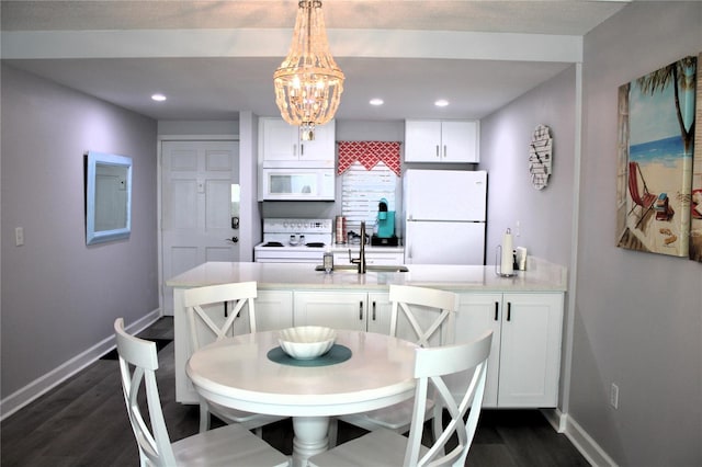 12760 Indian Rocks Rd Unit 909, Largo, FL 33774 - dining room featuring dark wood-type flooring, a chandelier, and recessed lighting