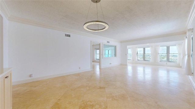 4950 Gulf Blvd Unit 903, St Pete Beach, FL 33706 - unfurnished room with ornamental molding, a textured ceiling, and a chandelier