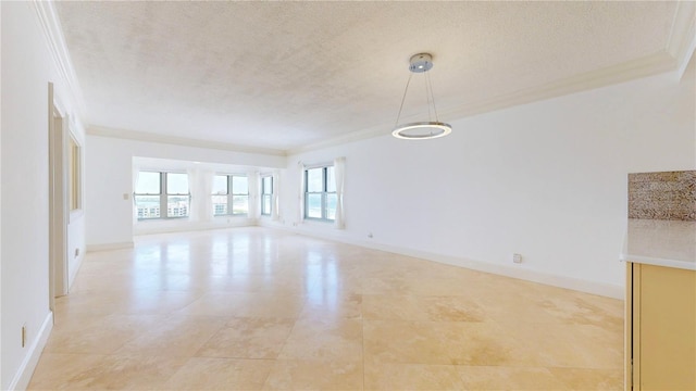 4950 Gulf Blvd Unit 903, St Pete Beach, FL 33706 - unfurnished living room with ornamental molding and a textured ceiling