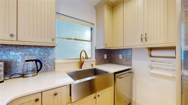 4950 Gulf Blvd Unit 903, St Pete Beach, FL 33706 - kitchen with light countertops, tasteful backsplash, dishwasher, and cream cabinets