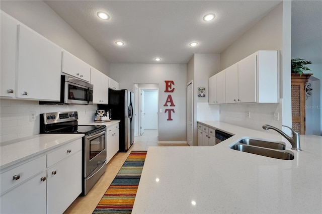 607 Tuscanny St, Brandon, FL 33511 - kitchen featuring stainless steel appliances, backsplash, recessed lighting, white cabinetry, and light stone countertops