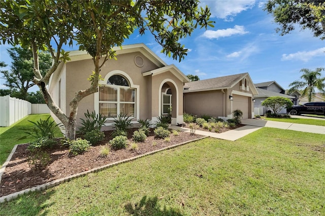 607 Tuscanny St, Brandon, FL 33511 - view of front of house featuring stucco siding, a garage, and driveway