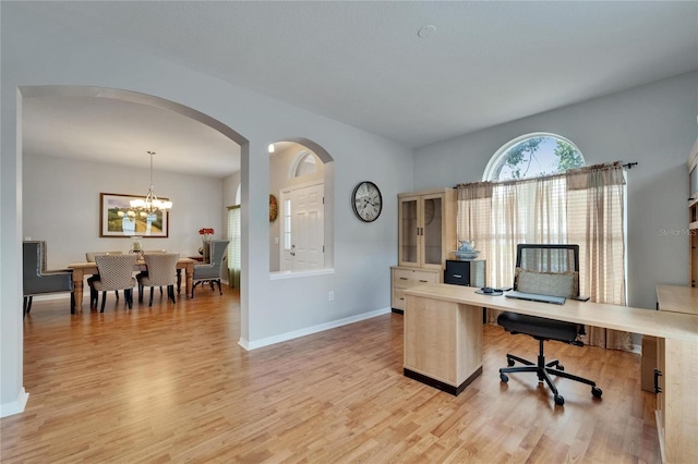 607 Tuscanny St, Brandon, FL 33511 - office space with arched walkways, light wood finished floors, and a chandelier