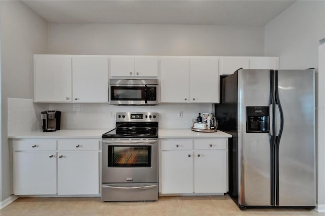 607 Tuscanny St, Brandon, FL 33511 - kitchen with stainless steel appliances, light countertops, white cabinetry, and decorative backsplash