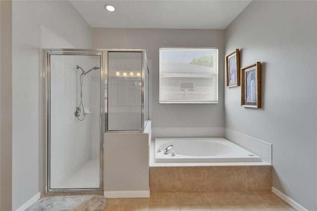607 Tuscanny St, Brandon, FL 33511 - bathroom with a shower stall, a bath, and tile patterned floors