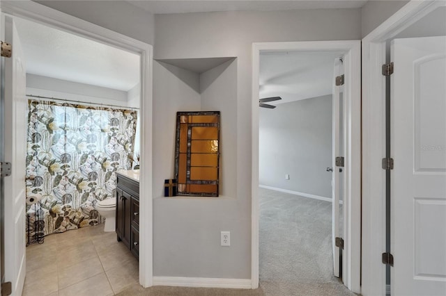 607 Tuscanny St, Brandon, FL 33511 - hallway featuring baseboards and light tile patterned floors