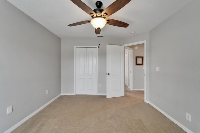607 Tuscanny St, Brandon, FL 33511 - unfurnished bedroom featuring light carpet, a closet, and ceiling fan