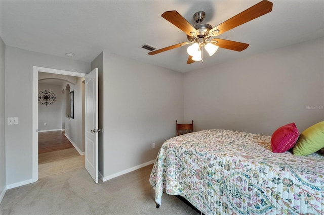 607 Tuscanny St, Brandon, FL 33511 - bedroom with arched walkways, light colored carpet, and ceiling fan