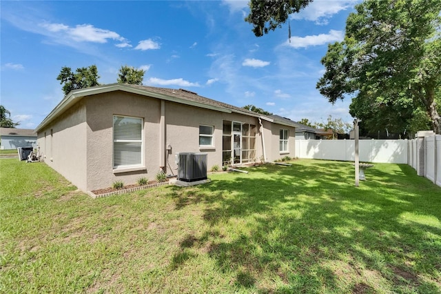 607 Tuscanny St, Brandon, FL 33511 - back of property featuring stucco siding and a fenced backyard
